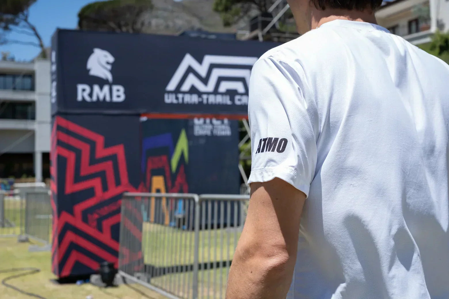Ultra Trailer wearing white Atmo t-shirt in front of Ultra Trail Cape Town start line