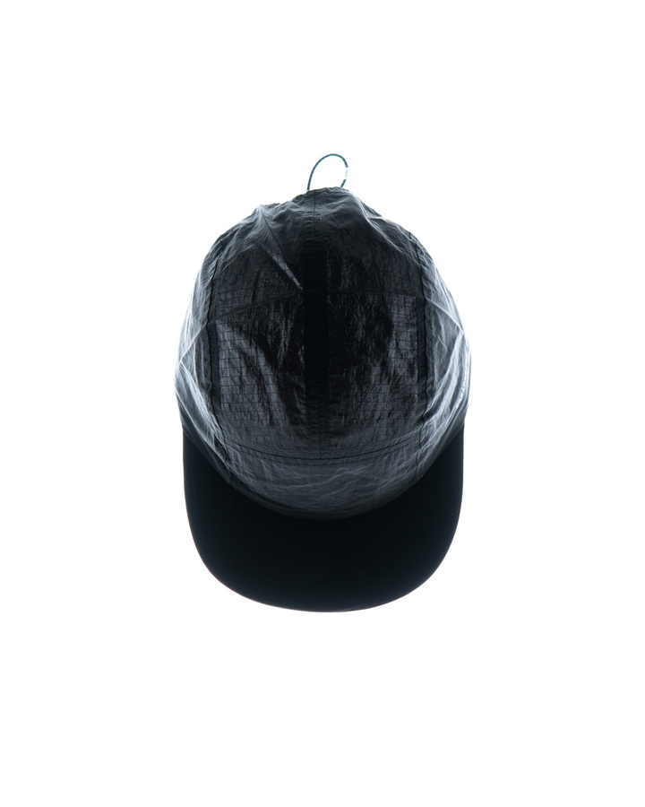 Lievre Running black performance running cap, lightweight technical fabric with adjustable back cord and “Engineered for the Art of Running” text on the side panel.