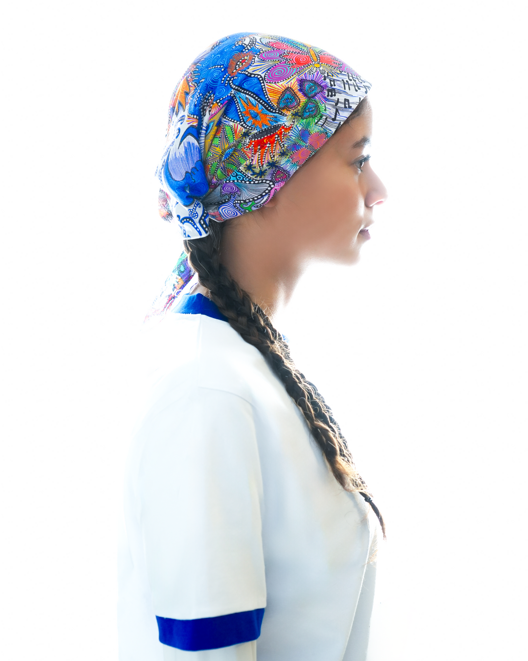 Art of Running bandana by Lievre Running featuring a vibrant multicolour illustrated pattern by artist Adrien Sabbah, lightweight fabric designed for running and outdoor use.