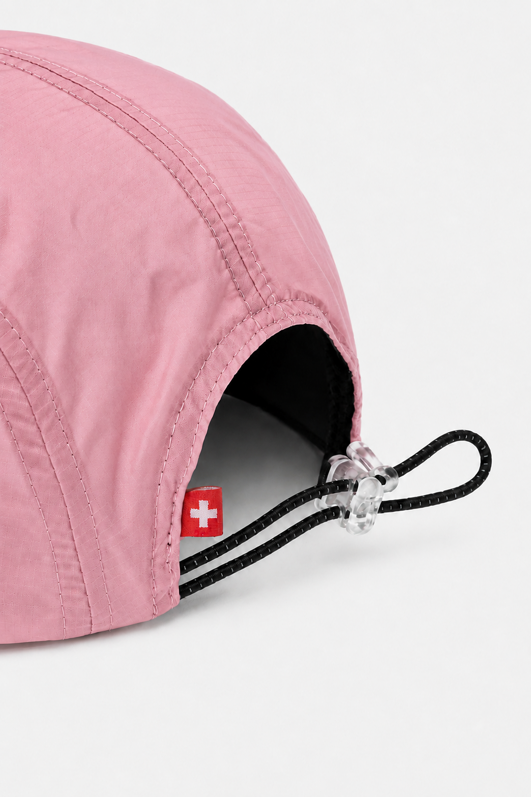 Lievre Running soft pink performance running cap, lightweight technical fabric with adjustable back cord and "Engineered for the Art of Running" text on the side panel.
