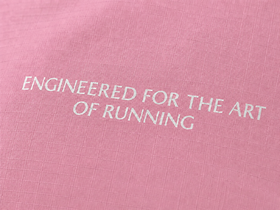 Lievre Running soft pink performance running cap, lightweight technical fabric with adjustable back cord and "Engineered for the Art of Running" text on the side panel.