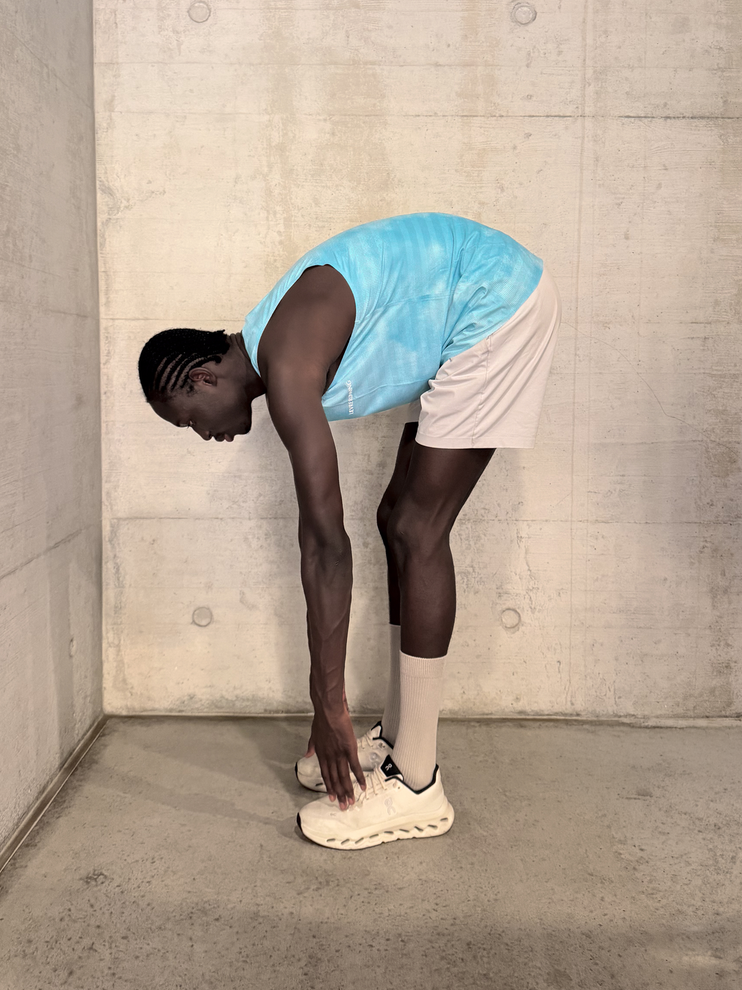 Lievre Running Sky Blue Singlet, 180g breathable stretch fabric cut sleeveless for maximum airflow, performance fit for warm-weather running and race days.