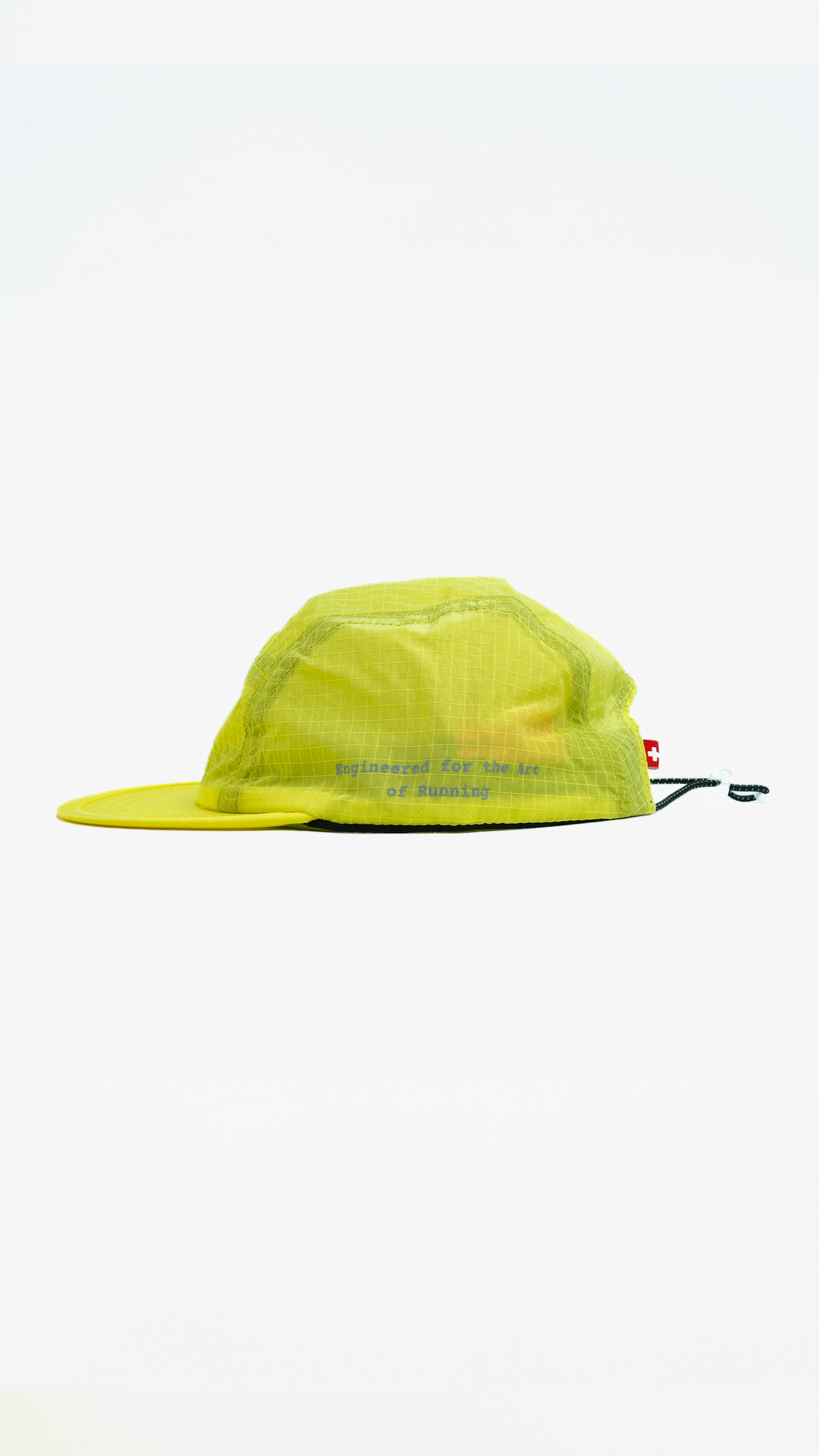 Lievre Running yellow performance running cap, lightweight technical fabric with adjustable back cord and “Engineered for the Art of Running” text on the side panel.