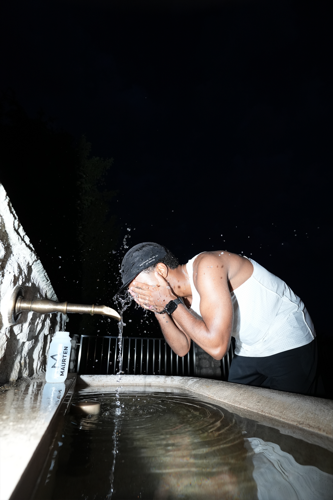 Lievre Running black performance running cap, lightweight technical fabric with adjustable back cord and “Engineered for the Art of Running” text on the side panel.