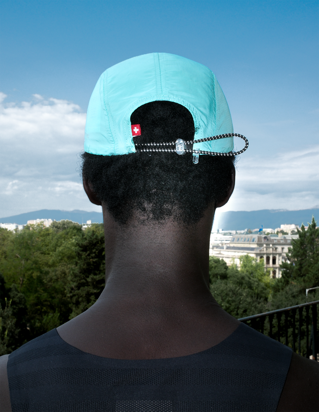 Lievre Running turquoise performance running cap, lightweight technical fabric with adjustable back cord and "Engineered for the Art of Running" text on the side panel.