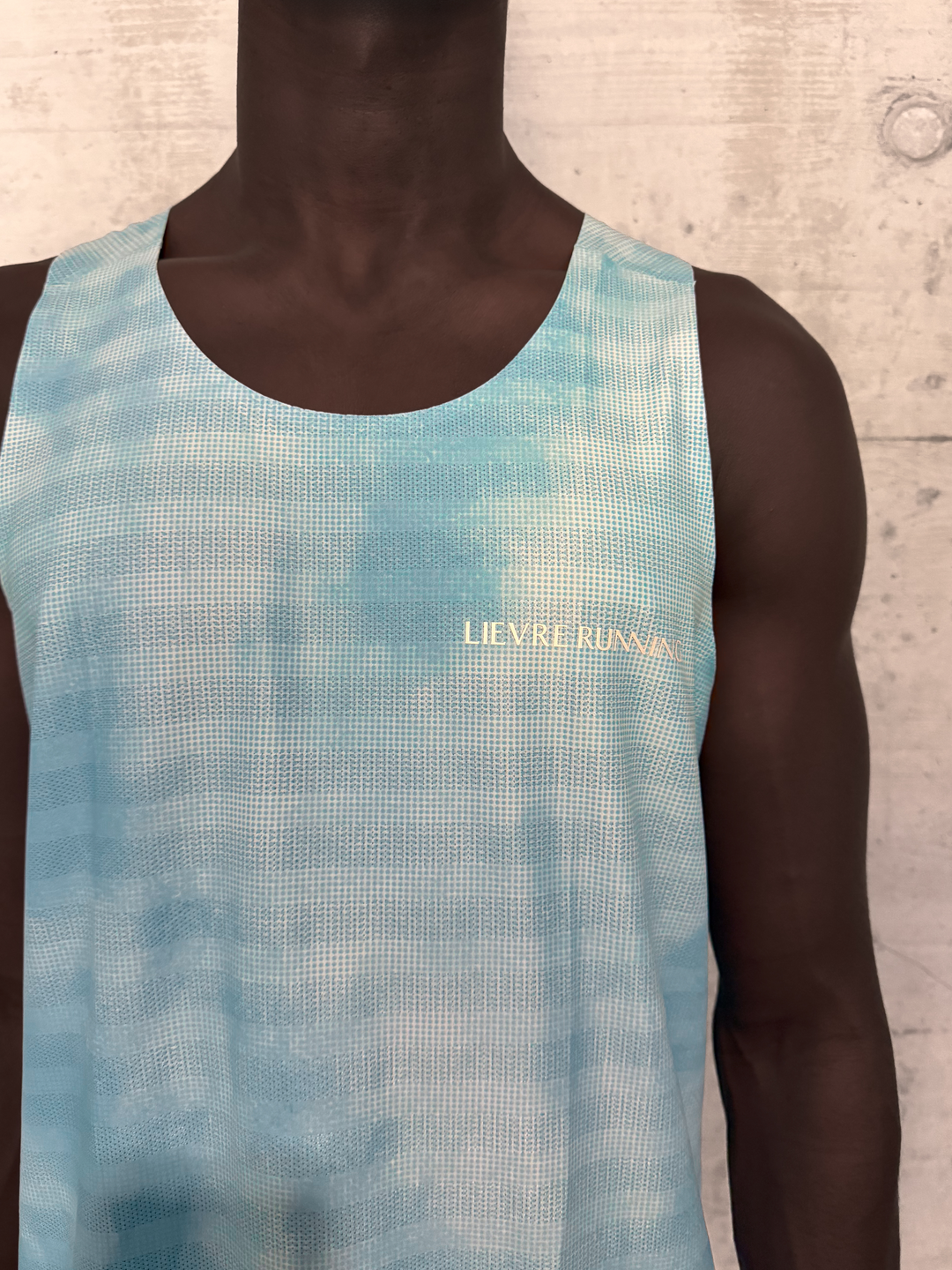 Lievre Running Sky Blue Singlet, 180g breathable stretch fabric cut sleeveless for maximum airflow, performance fit for warm-weather running and race days.