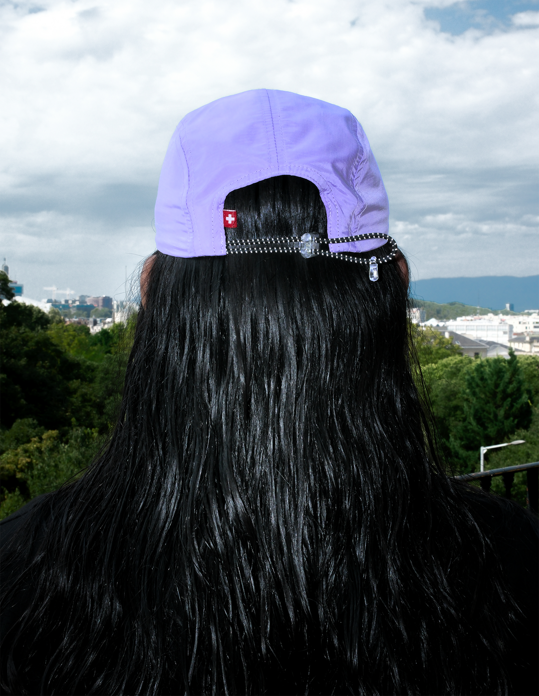 Lievre Running lavender performance running cap, lightweight technical fabric with adjustable back cord and "Engineered for the Art of Running" text on the side panel.