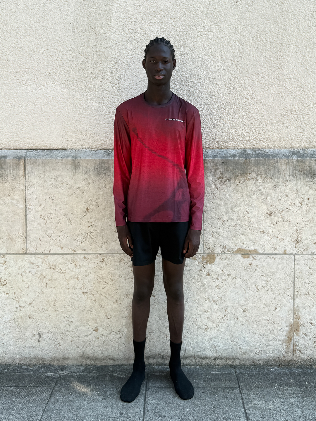 Lievre Running Lightweight Red LS shirt showcasing a gradient of red tones inspired by the French flag.