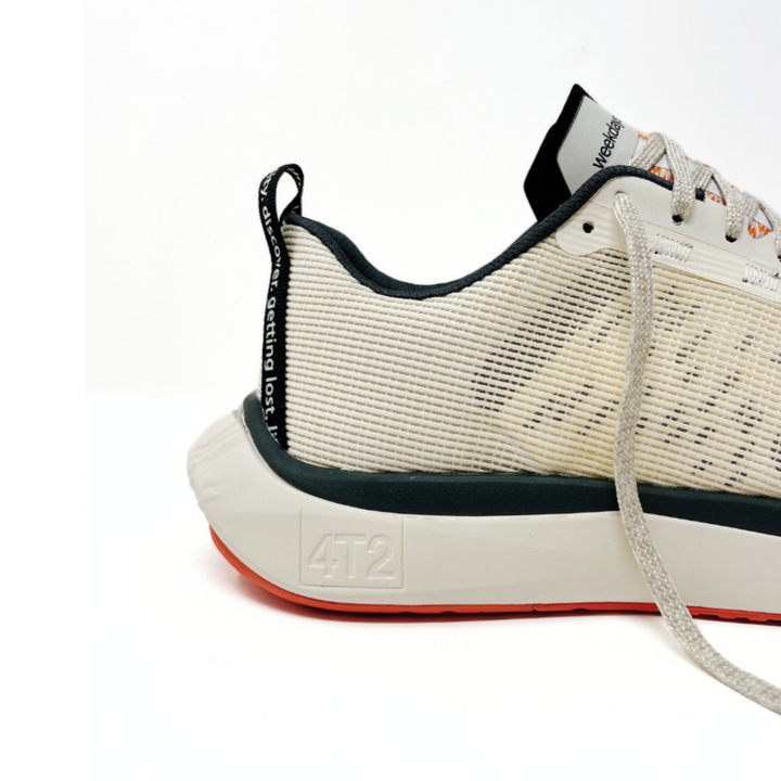 Close-up view of 4T2 weekdays vintage white running shoes showcasing comfort features and durable outsole.