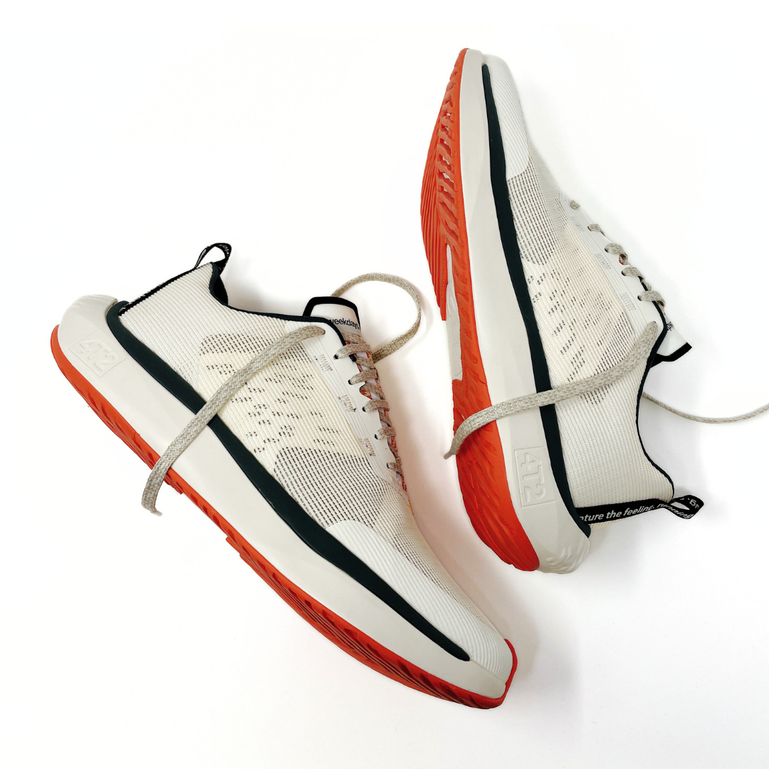 Close-up view of 4T2 weekdays vintage white running shoes showcasing comfort features and durable outsole.