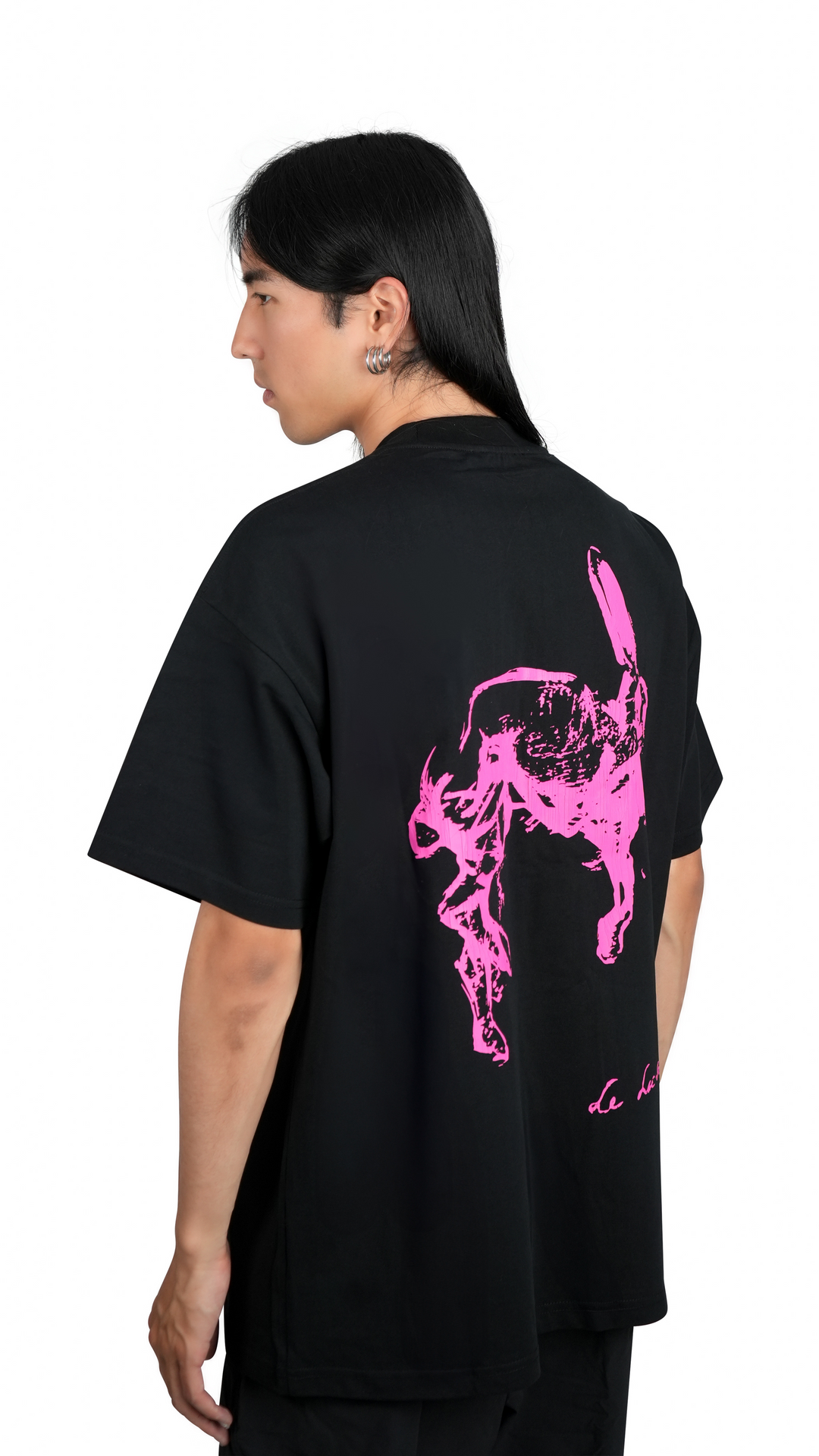 Lievre Running black cotton tee with oversized fit, featuring a bold pink graphic of a running hare on the back and subtle script detail near the hem.