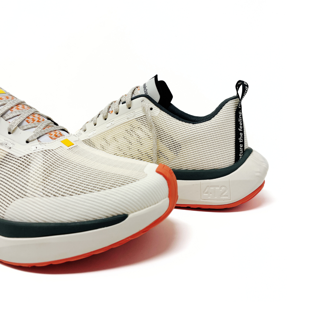 Close-up view of 4T2 weekdays vintage white running shoes showcasing comfort features and durable outsole.