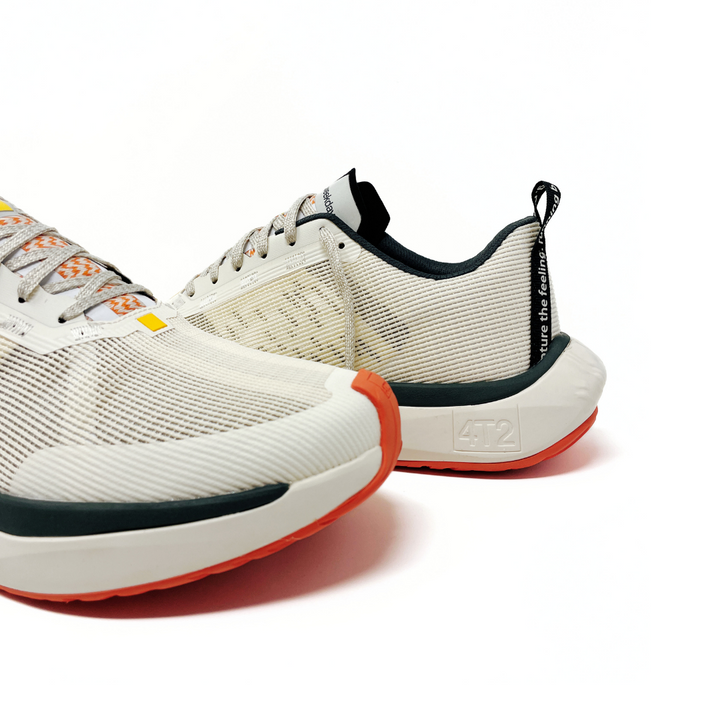 Close-up view of 4T2 weekdays vintage white running shoes showcasing comfort features and durable outsole.