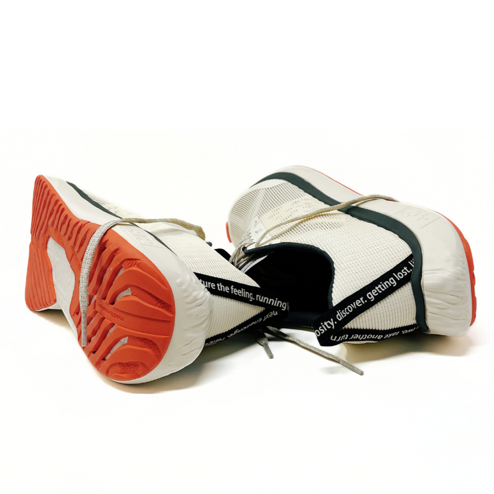 Close-up view of 4T2 weekdays vintage white running shoes showcasing comfort features and durable outsole.