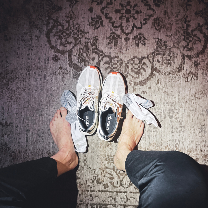 Close-up view of 4T2 weekdays vintage white running shoes showcasing comfort features and durable outsole.