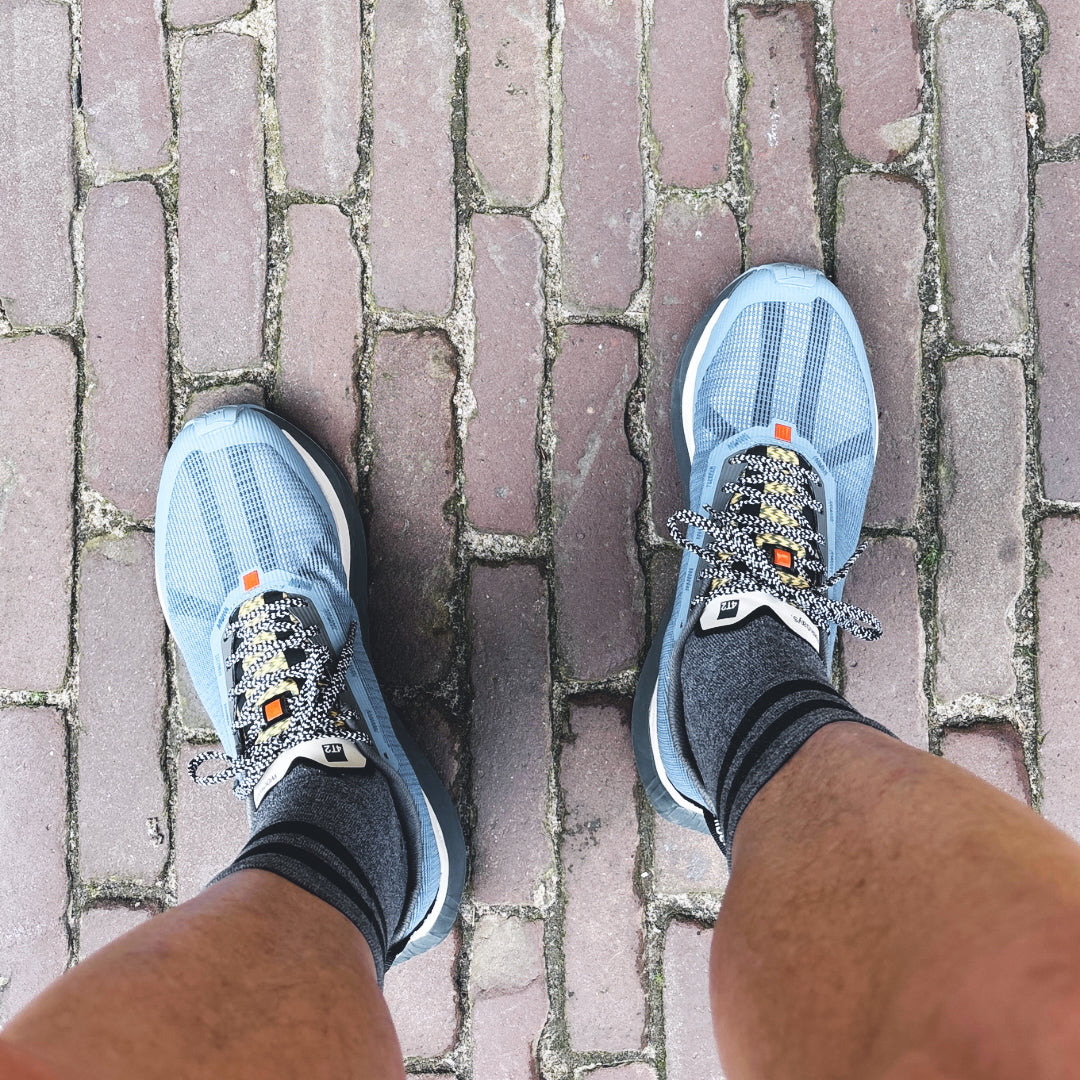 4T2 - weekdays, kind of blue running shoe, showcasing a modern design ideal for urban running.