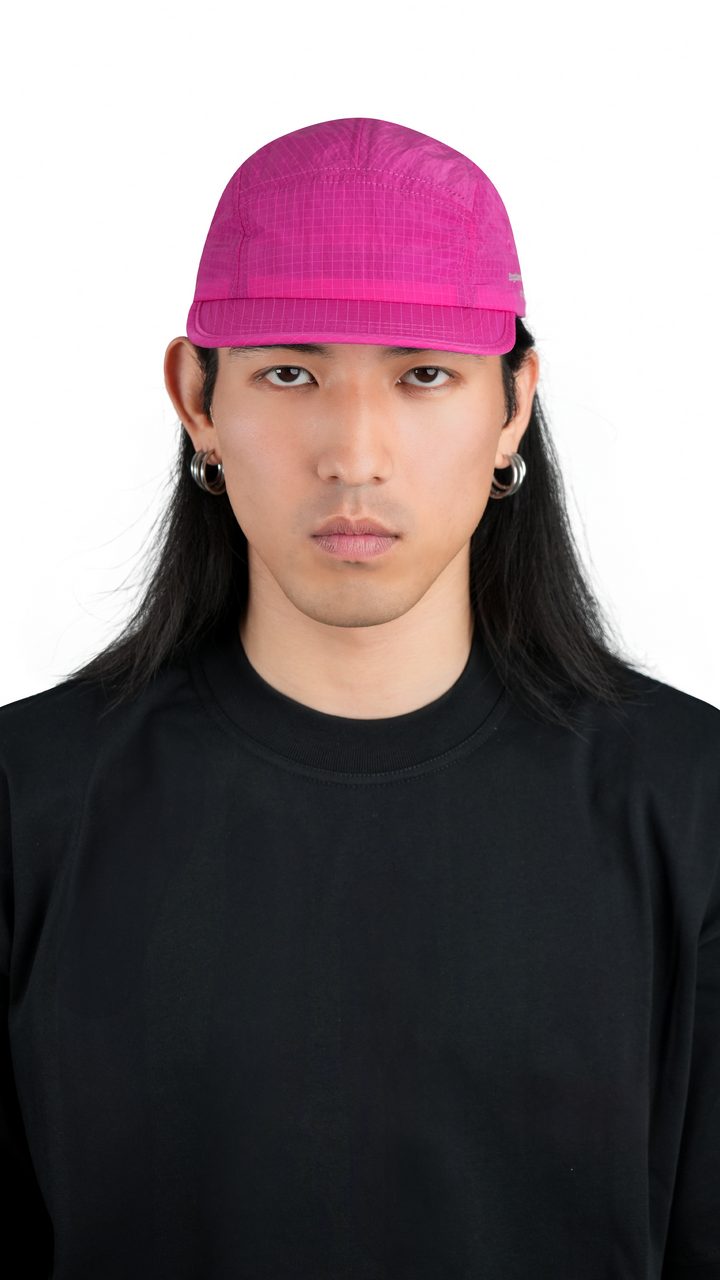 Lievre Running pink performance running cap, lightweight technical fabric with adjustable back cord and “Engineered for the Art of Running” text on the side panel.