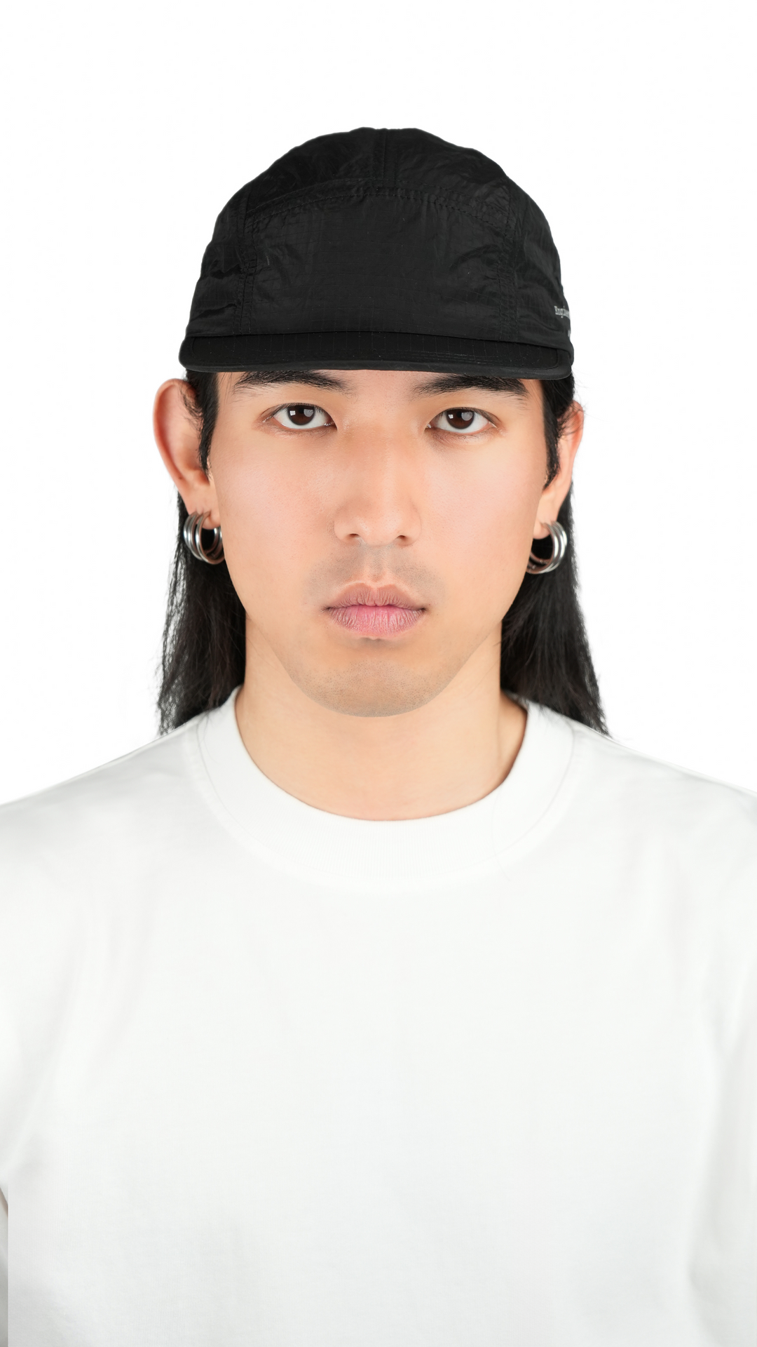 Lievre Running black performance running cap, lightweight technical fabric with adjustable back cord and “Engineered for the Art of Running” text on the side panel.