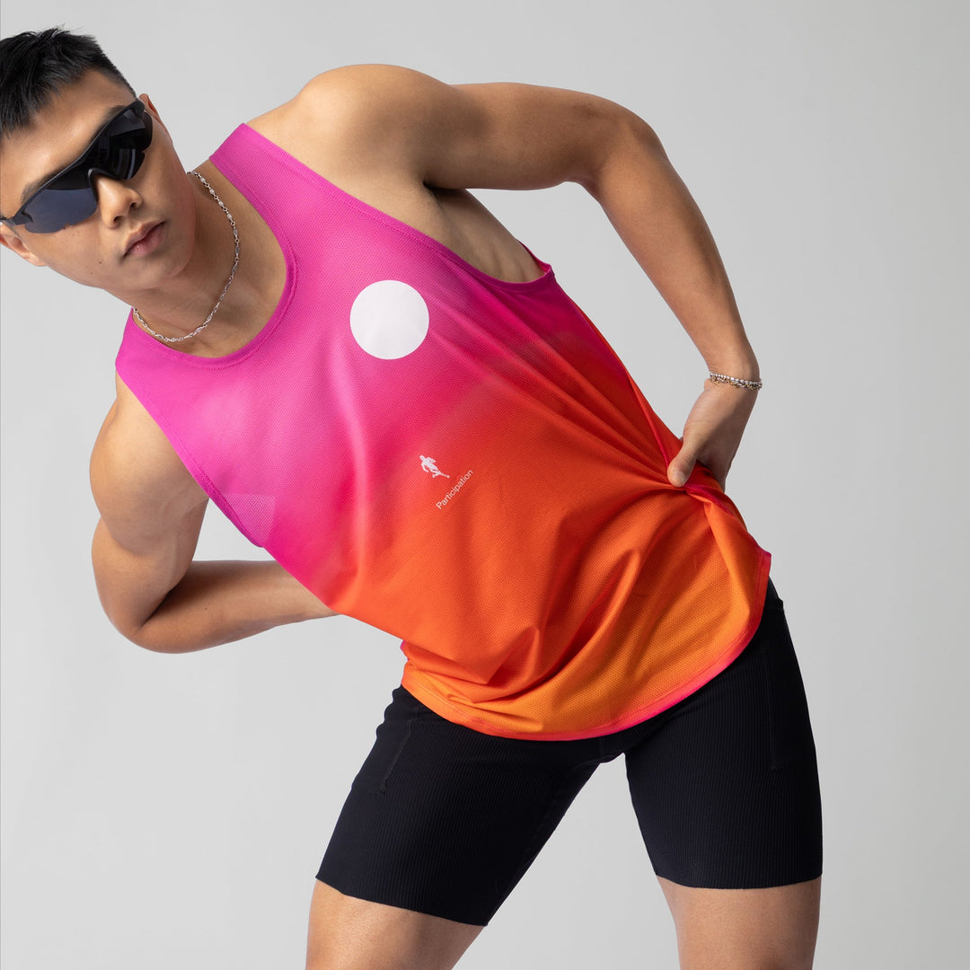 Front view of the Participation Pink Glow Singlet showcasing its breathable fabric and vibrant pink color.