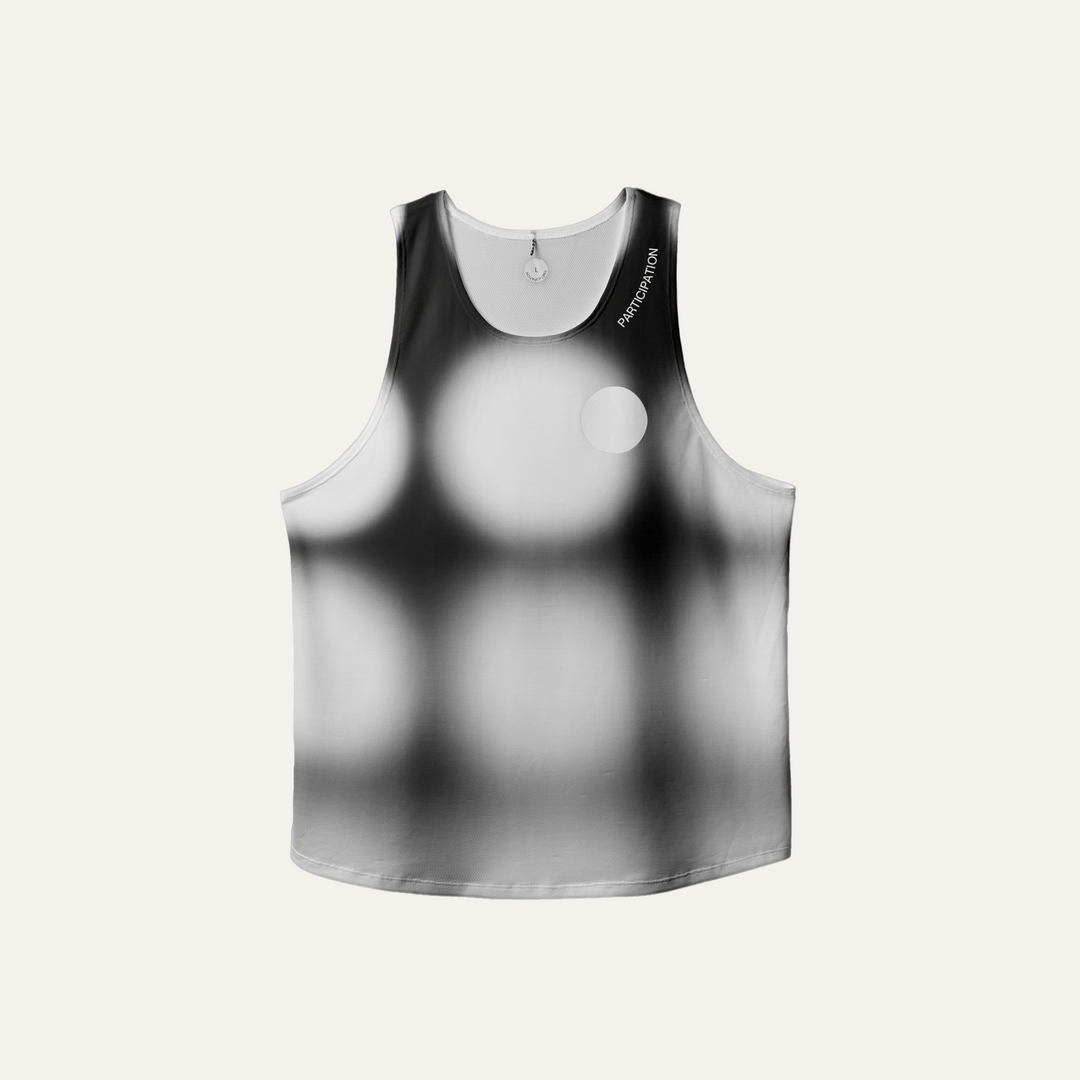 Front view of the Participation Polka Dots Singlet showcasing its breathable design and polka dot pattern.