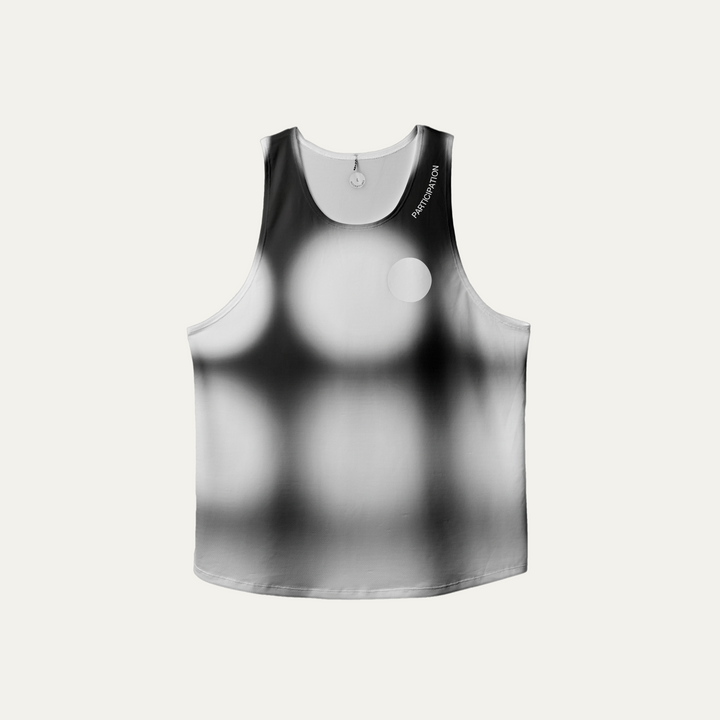 Front view of the Participation Polka Dots Singlet showcasing its breathable design and polka dot pattern.
