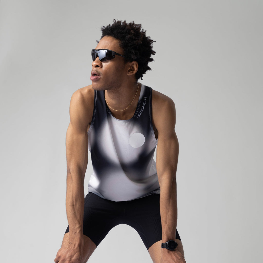 Front view of the Participation Polka Dots Singlet showcasing its breathable design and polka dot pattern.