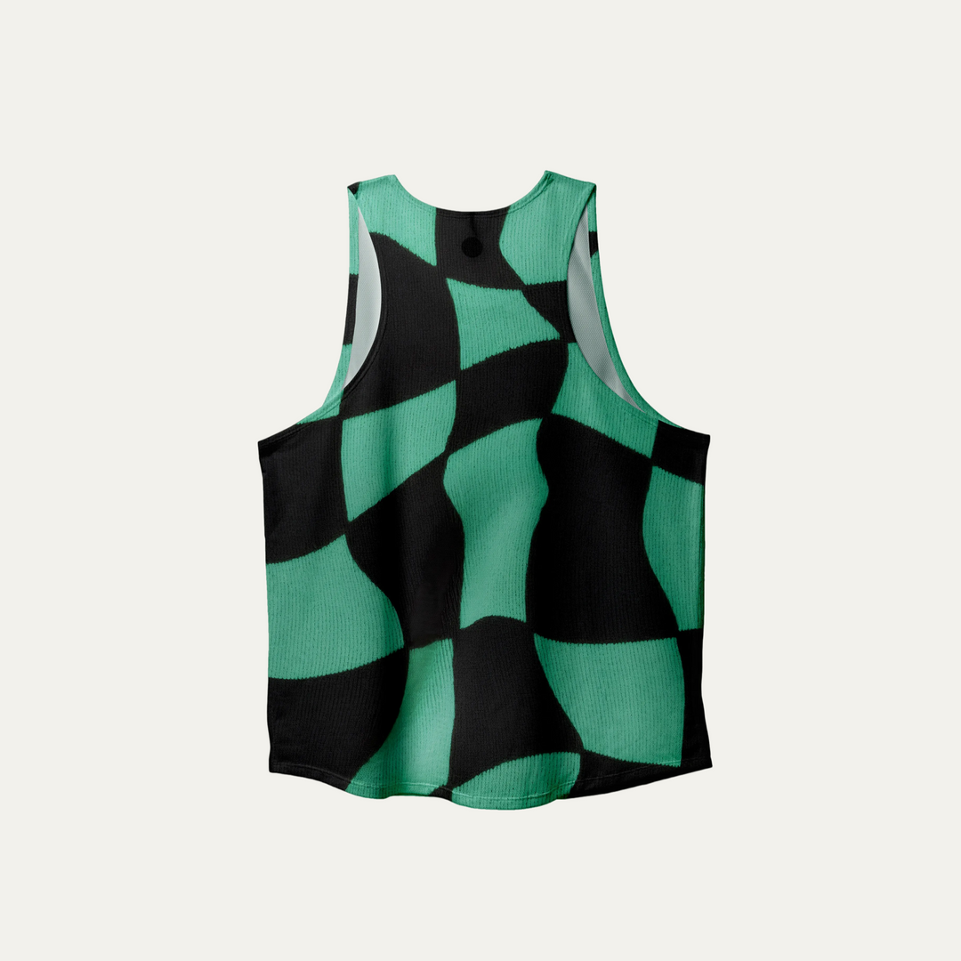 A woman wearing the Green Checker Singlet, showcasing its breathable design and checkered pattern, perfect for running and outdoor activities.