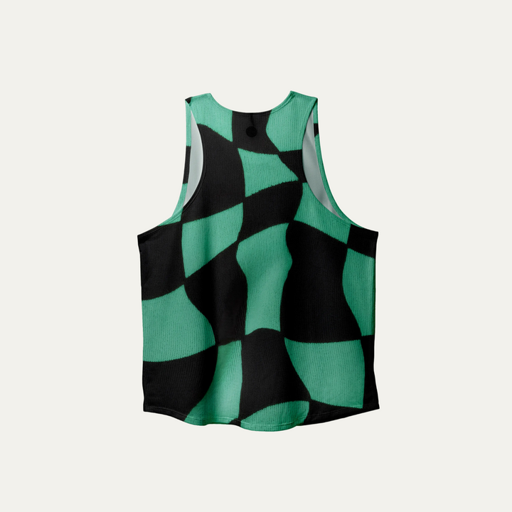A woman wearing the Green Checker Singlet, showcasing its breathable design and checkered pattern, perfect for running and outdoor activities.