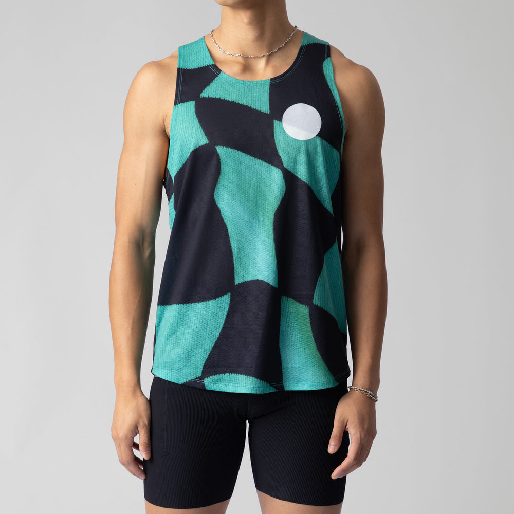 A woman wearing the Green Checker Singlet, showcasing its breathable design and checkered pattern, perfect for running and outdoor activities.