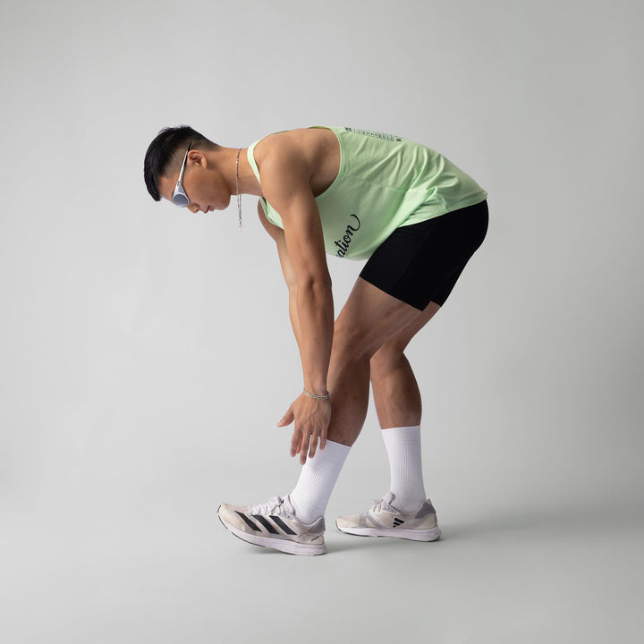 Lightweight green pistachio Exercise Singlet by Participation, designed for breathability and quick-drying for workouts.