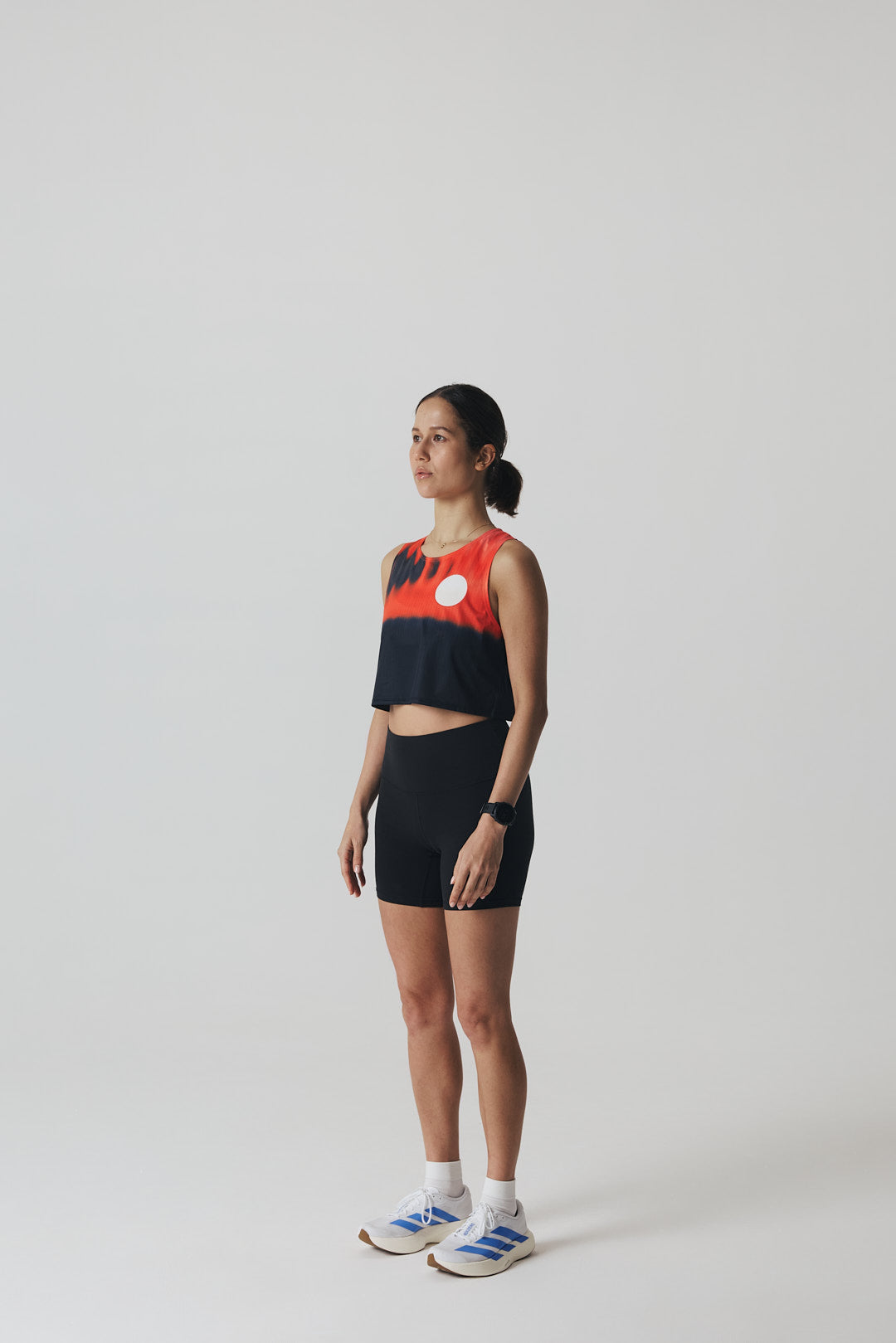 Participation Red Glass running crop top, breathable mesh, red-black gradient, white circle logo on chest.