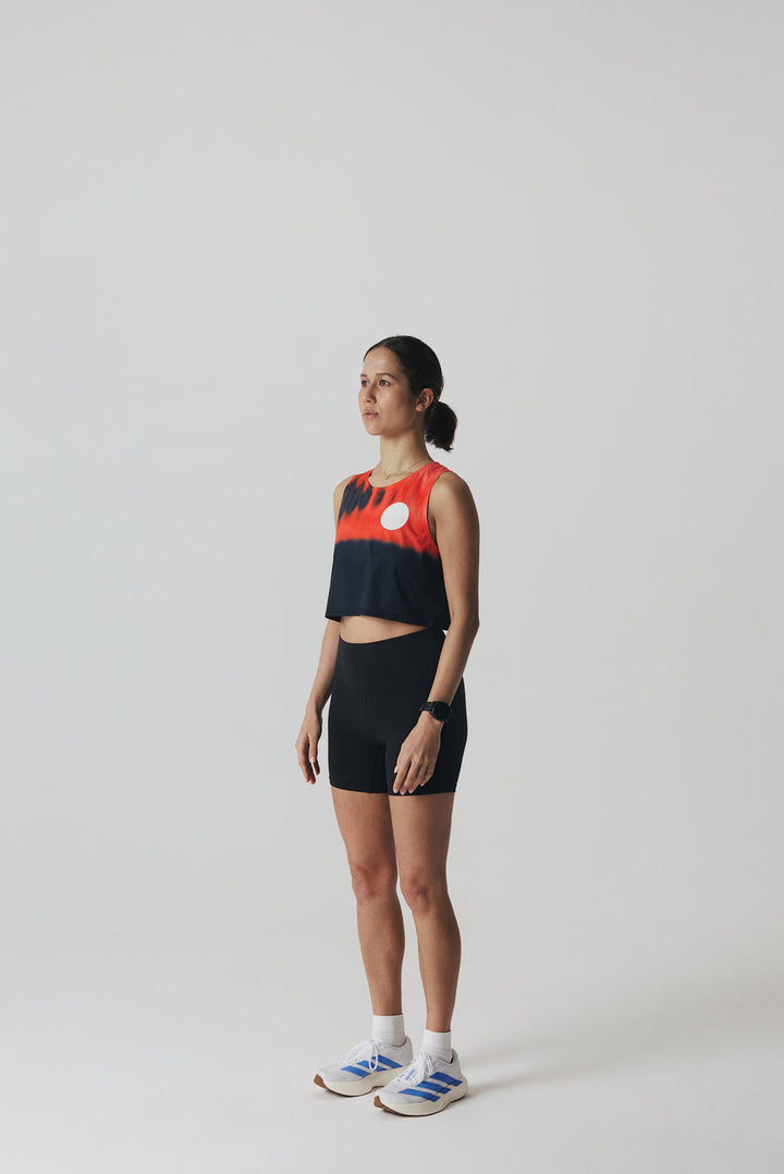 Participation Red Glass running crop top, breathable mesh, red-black gradient, white circle logo on chest.