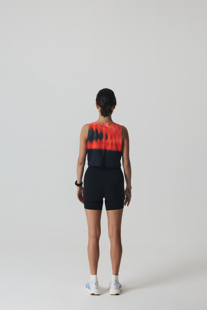 Participation Red Glass running crop top, breathable mesh, red-black gradient, white circle logo on chest.