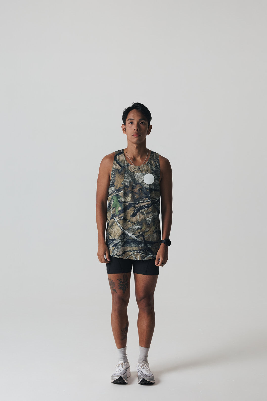 Participation Real Tree singlet, breathable mesh, camo forest print, white circle logo on chest.