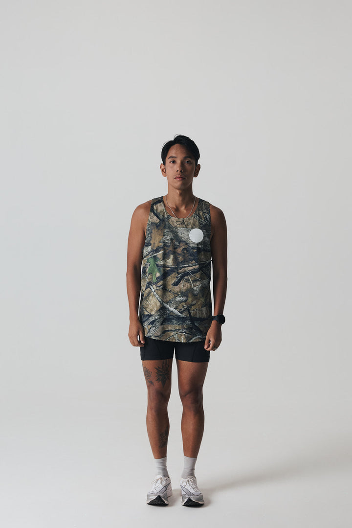 Participation Real Tree singlet, breathable mesh, camo forest print, white circle logo on chest.