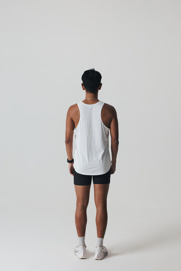 Participation black singlet, breathable mesh, white circle logo on chest.