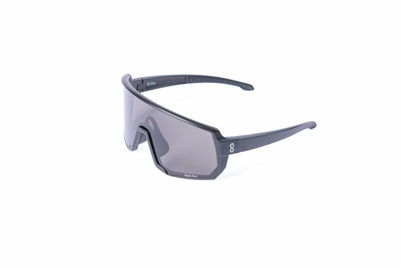 Coast Optics Black Echo Sunglasses with a dark frame and clear lenses on a white background
