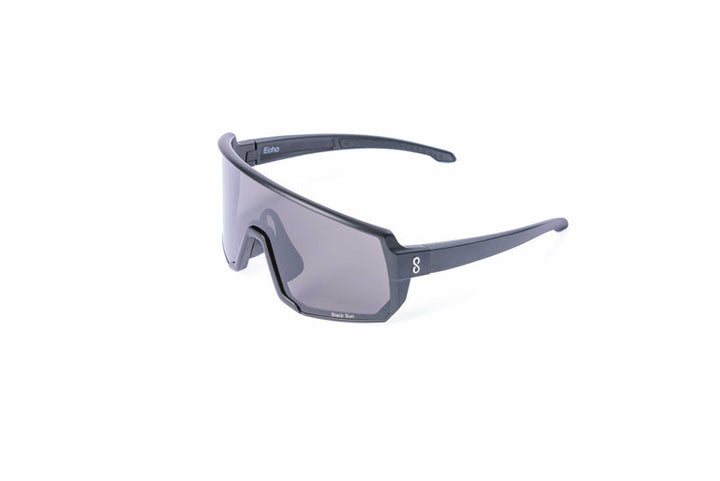 Coast Optics Black Echo Sunglasses with a dark frame and clear lenses on a white background