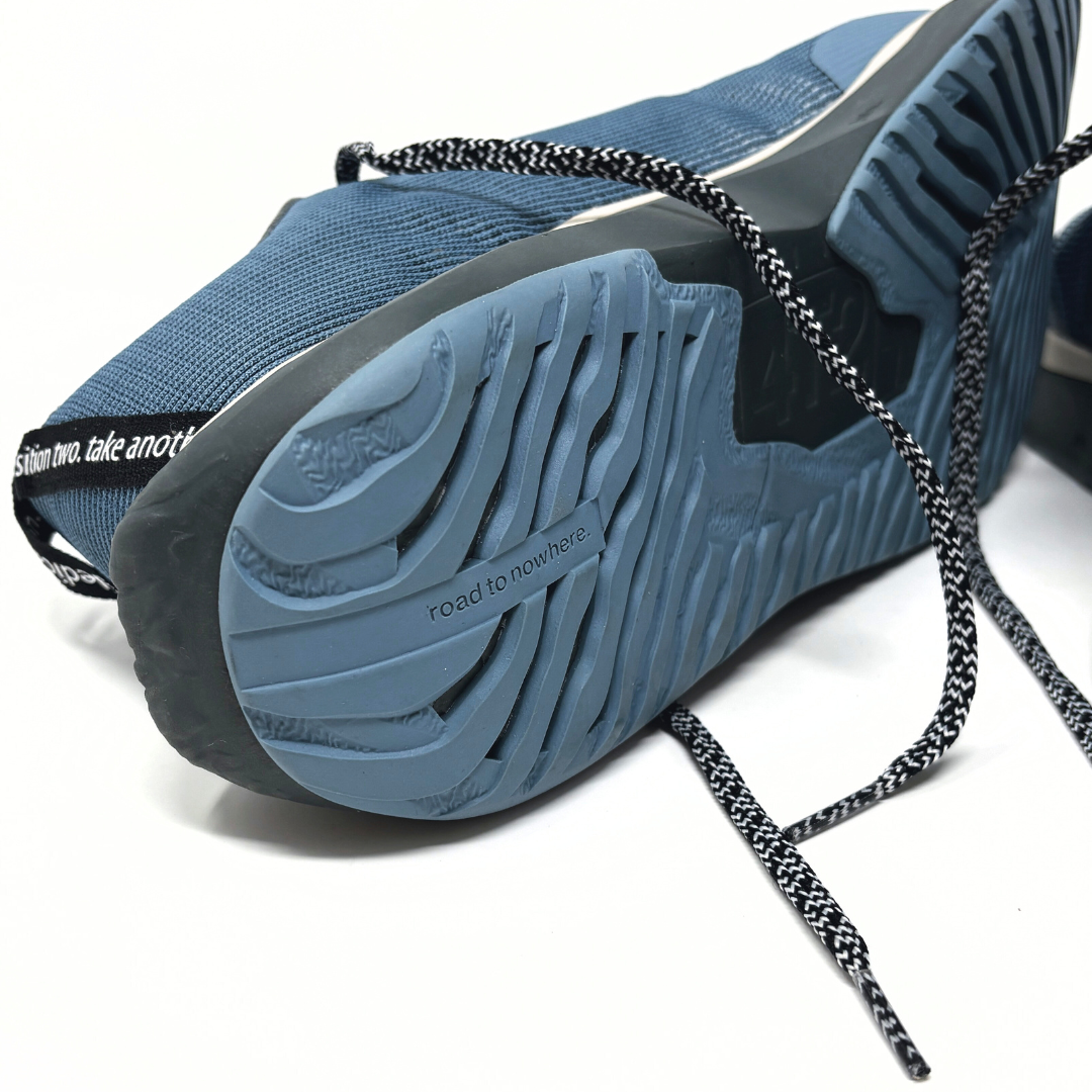 4T2 - weekdays, kind of blue running shoe, showcasing a modern design ideal for urban running.