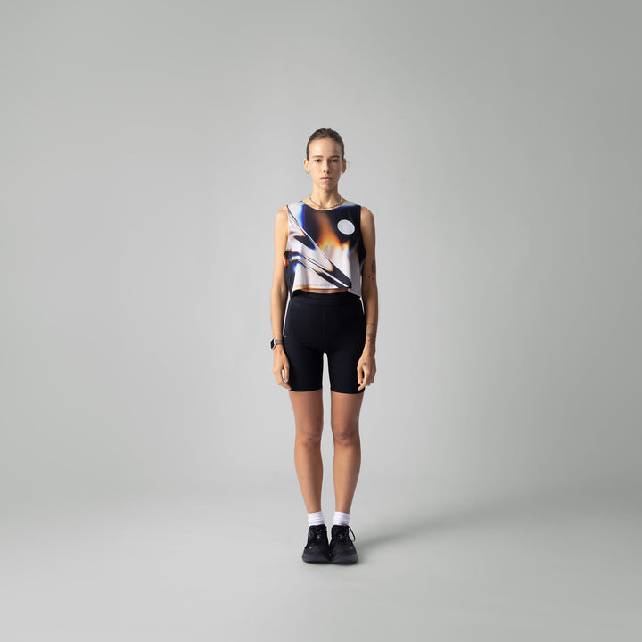 Front view of the Participation White Glass Crop Singlet showcasing its unique design.