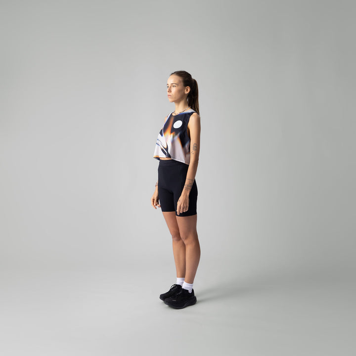 Front view of the Participation White Glass Crop Singlet showcasing its unique design.