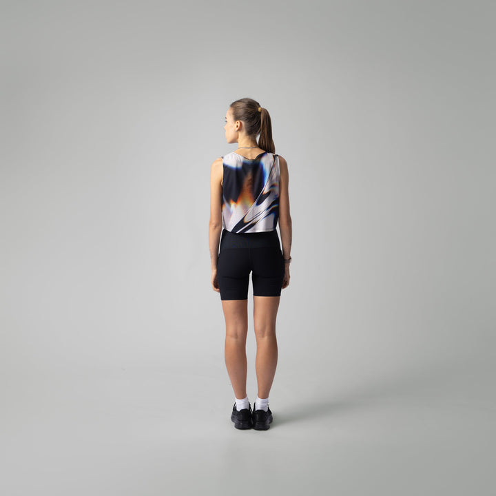 Front view of the Participation White Glass Crop Singlet showcasing its unique design.