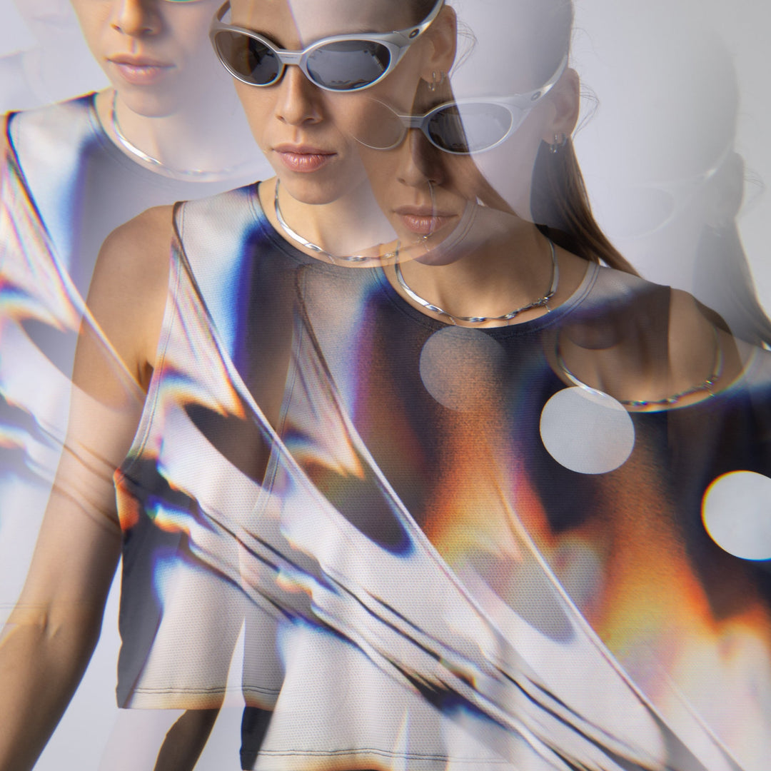 Front view of the Participation White Glass Crop Singlet showcasing its unique design.