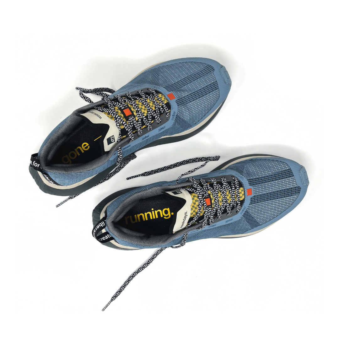 4T2 - weekdays, kind of blue running shoe, showcasing a modern design ideal for urban running.