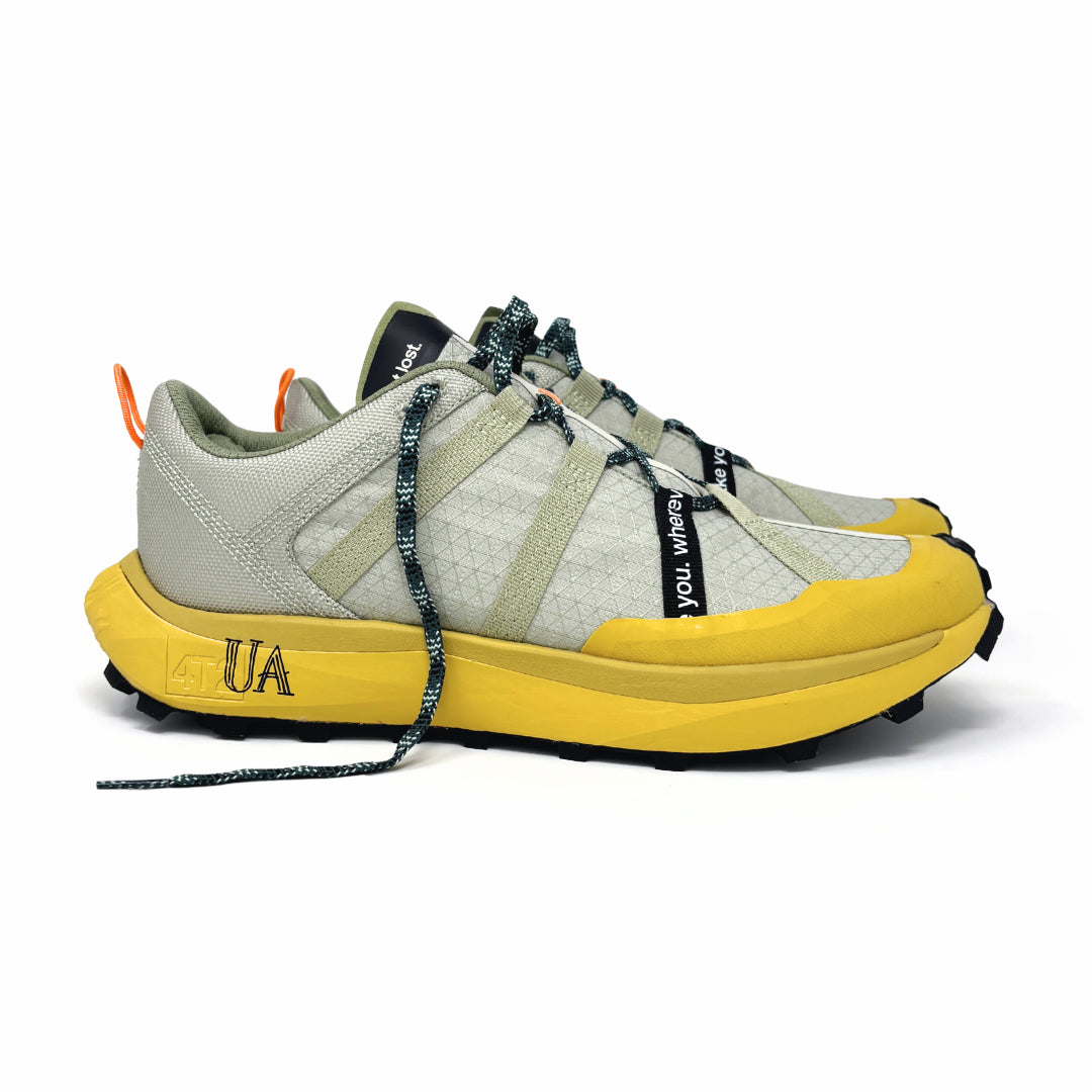 4T2 get lost footwear in beige and green, designed for trail running with a Vibram outsole.