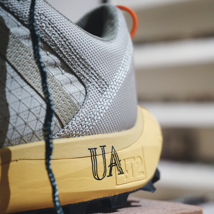 4T2 get lost footwear in beige and green, designed for trail running with a Vibram outsole.