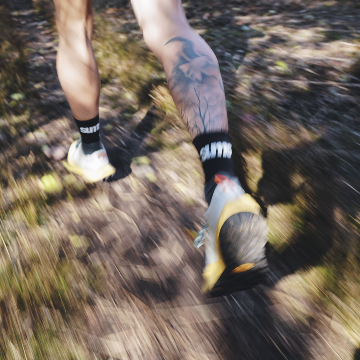 4T2 get lost footwear in beige and green, designed for trail running with a Vibram outsole.