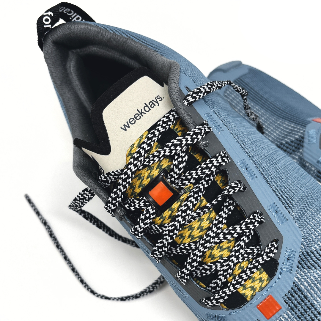 4T2 - weekdays, kind of blue running shoe, showcasing a modern design ideal for urban running.