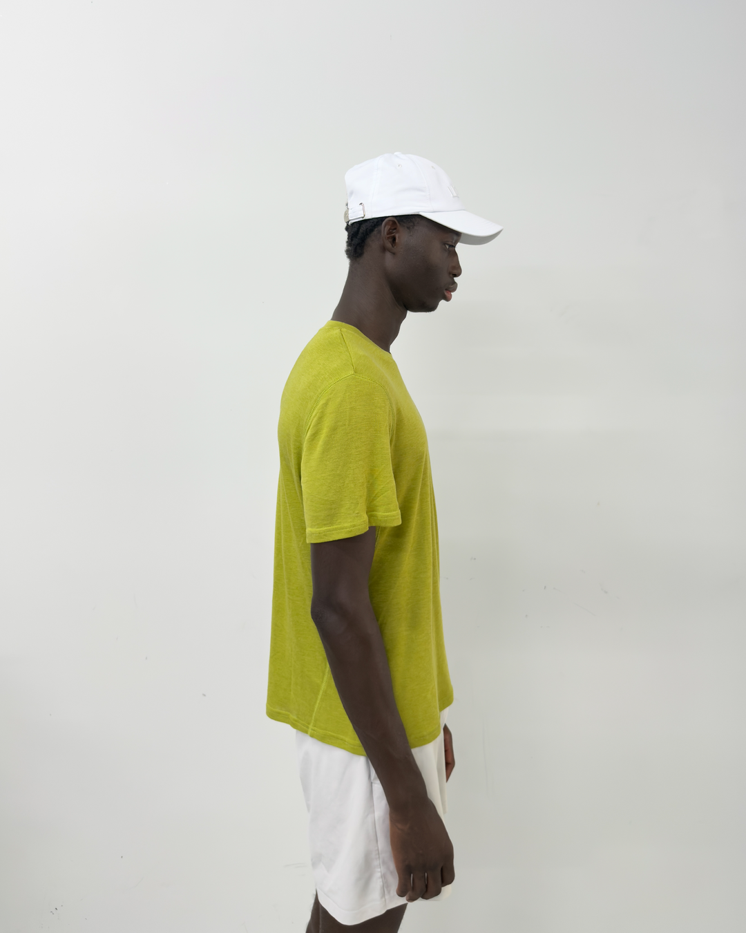 Lievre Running Signature White Cap, ultra-lightweight technical nylon construction with minimal design and adjustable back cord.