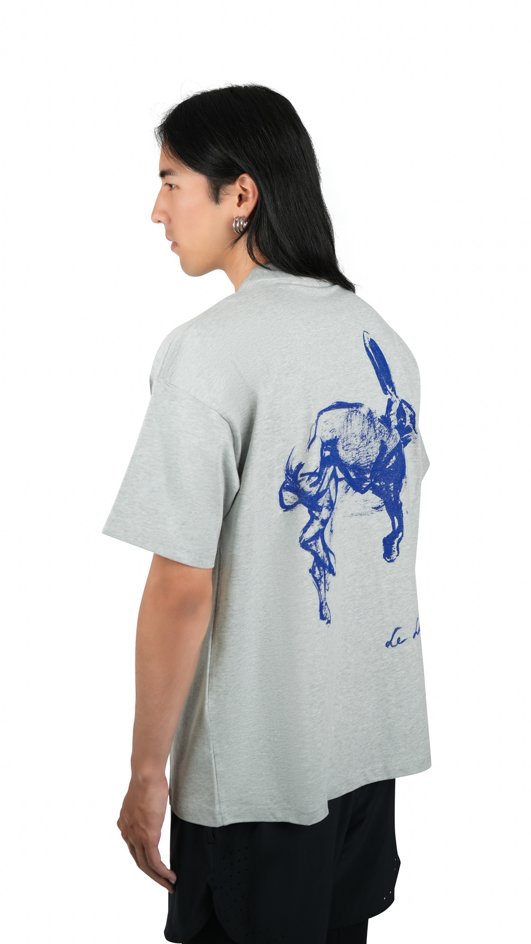 Lievre Running grey cotton tee with relaxed fit, featuring a large blue graphic of a running hare on the back and subtle script detail near the hem.